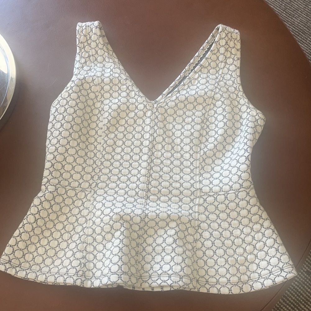 Delicate and beautiful peplum top from Anthropologie ( Maeve)